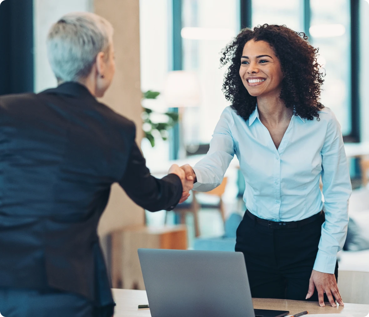 Women closing a deal in office