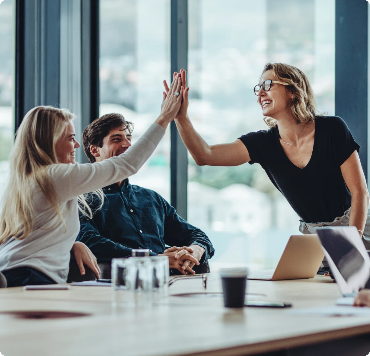 Team celebrating with high five