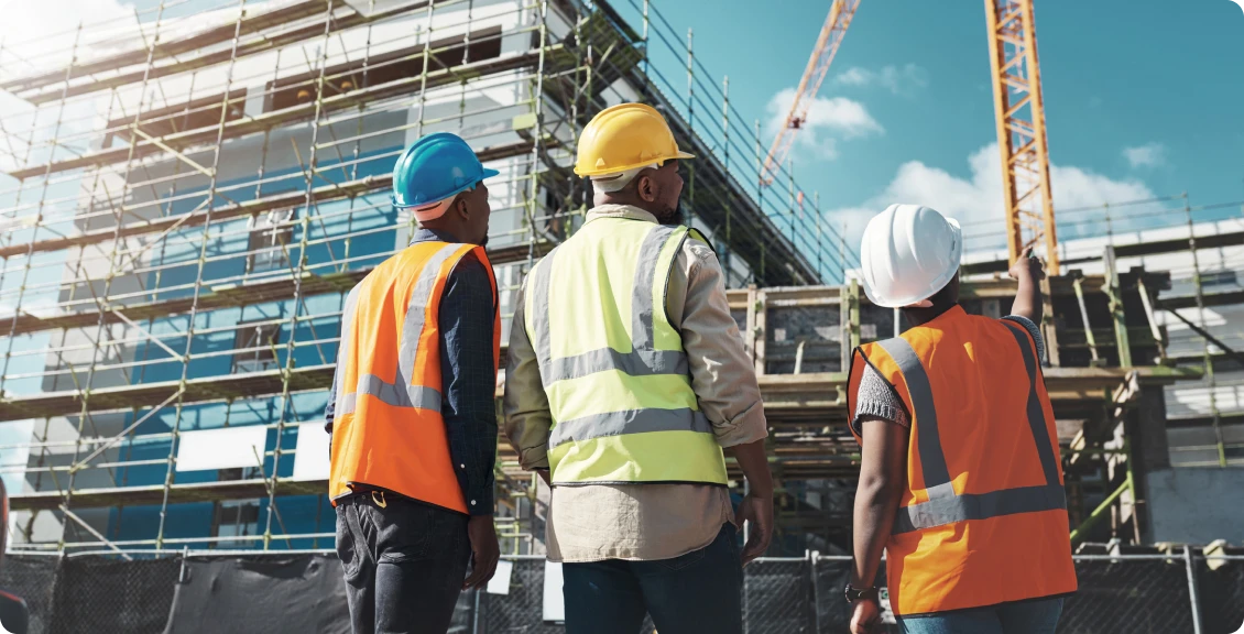 Workers in safety gear at construction site